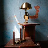 Stainless steel candleholder set on a wooden table