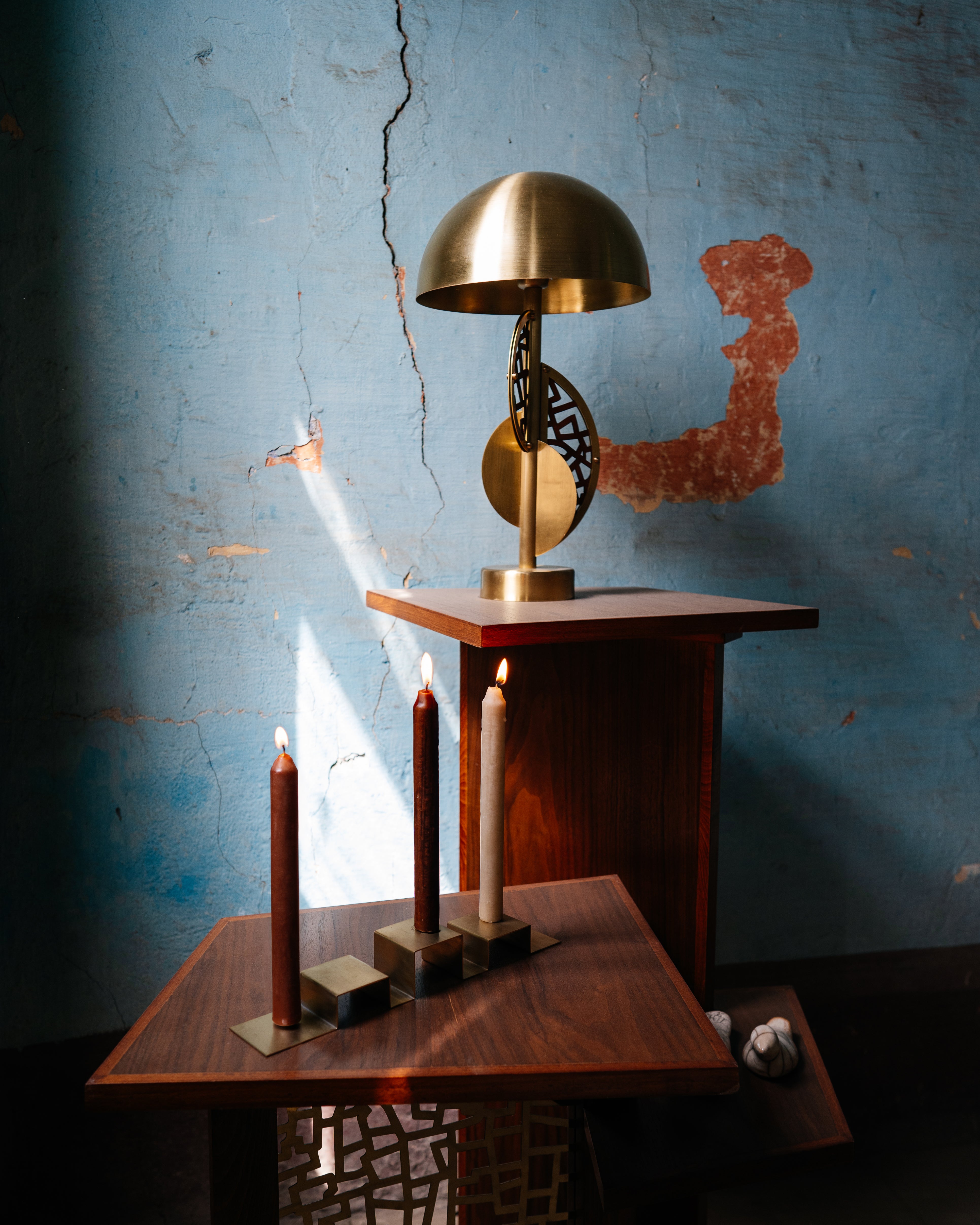 Stainless steel candleholder set on a wooden table