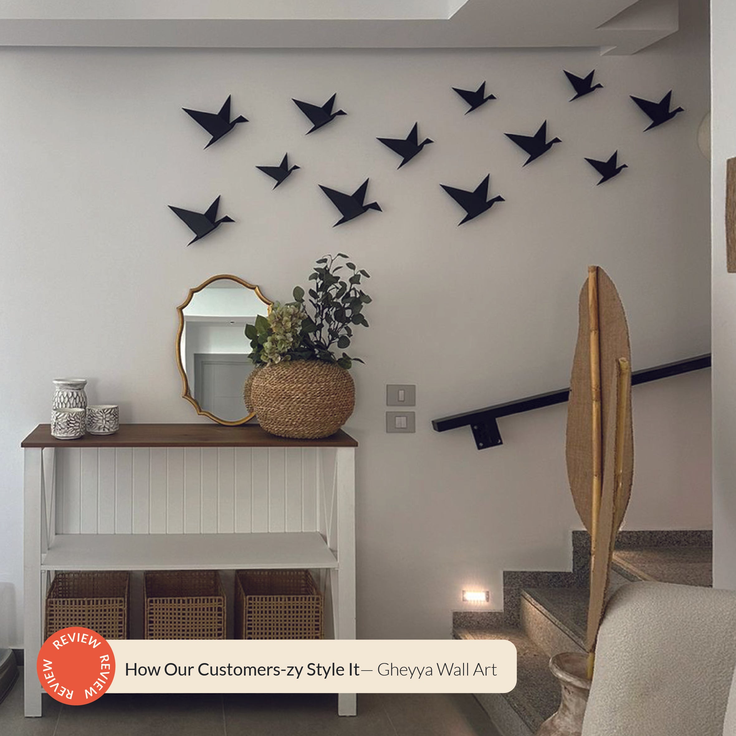 A collection of black Gheyya wall art pieces hung on a wall, enhancing a modern home decor