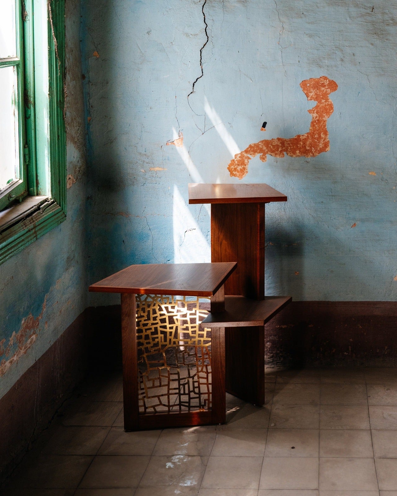 Corner wooden table featuring three tiered levels