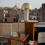 A close-up of a wooden table in a photoshoot in Egypt