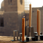 Close-up of stainless steel candleholders 